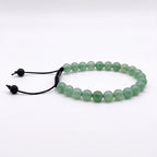 Pulsera minimalista de piedras de aventurina natural con nudo corredizo y espaciador metálico de la marca KRV.