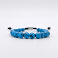 Pulsera de turquesa azul natural con nudo corredizo y espaciador metálico de la marca KRV.