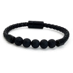 Pulsera de cuero negro trenzado con cuentas de piedra volcánica natural, diseño masculino y elegante de KRV Accesorios.