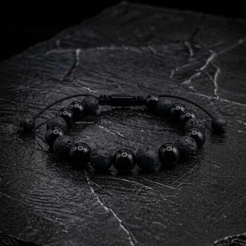 Pulsera de piedra turmalina intercalada con piedra volcánica con cierre ajustable macramé