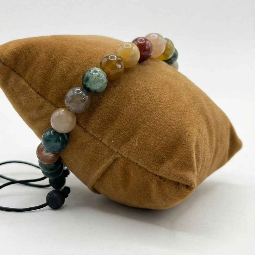 Pulsera de hombre con cuentas esféricas de Ágata India natural mostrando variedad de colores verde, rojo y tonos tierra