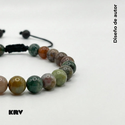 Pulsera de hombre con cuentas esféricas de Ágata India natural mostrando variedad de colores verde, rojo y tonos tierra.