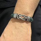 Pulsera de cuero verde trenzado para hombre con símbolo de infinito metálico central y cierre magnético, krv accesorios, envio gratis y contraentrega disponible a toda Colombia