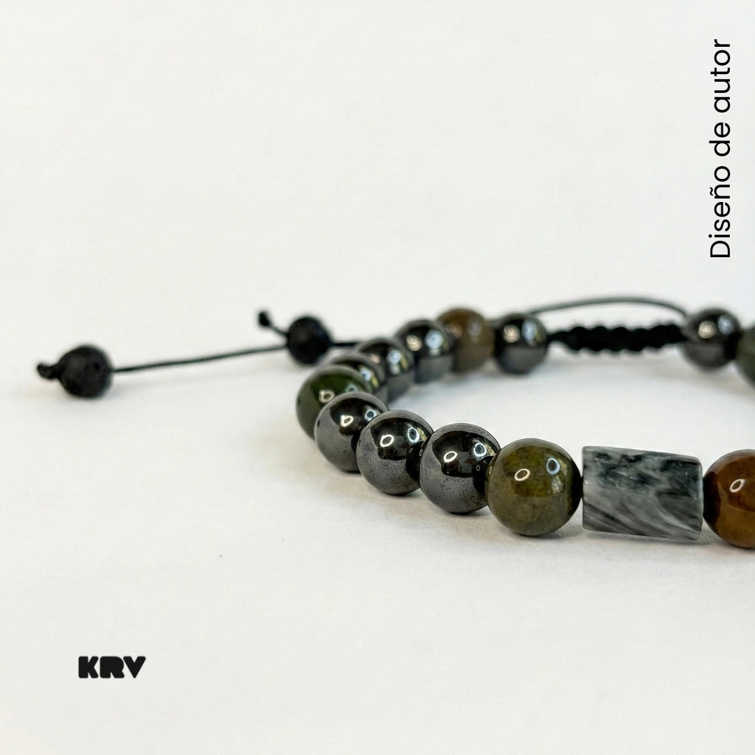 Pulsera ajustable para hombre de piedra natural Hematita con piedra central de Ojo de Halcón genuino.