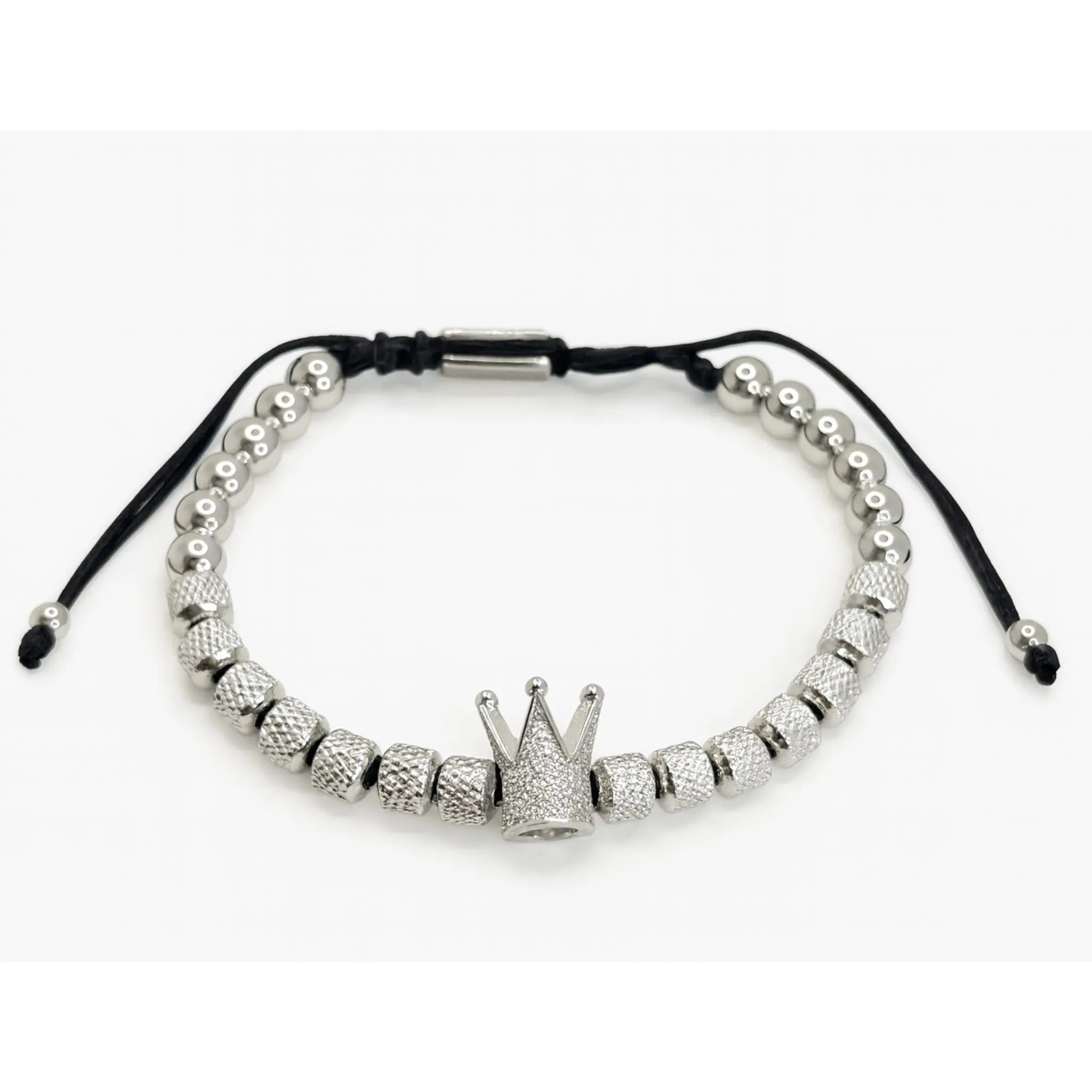Pulsera de acero inoxidable ajustable para hombre con dije de corona piedra circonita blanca. Color plateado