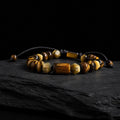 Pulsera hombre ojo de tigre natural con piedra central tallada a mano