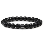 Pulsera de turmalina negra natural con piedra central de hematita para hombre – protección y estilo elegante