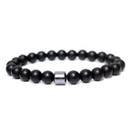 Pulsera de ónix negro mate con piedra central de hematita para hombre – accesorio minimalista y elegante