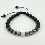 Pulsera para hombre con piedra natural  jaspe cebra y ónix con nudo corredizo y hecho con hilo chino 
