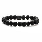 Pulsera de piedras volcánicas negras con detalle central de hematita para hombre – estilo minimalista y elegante